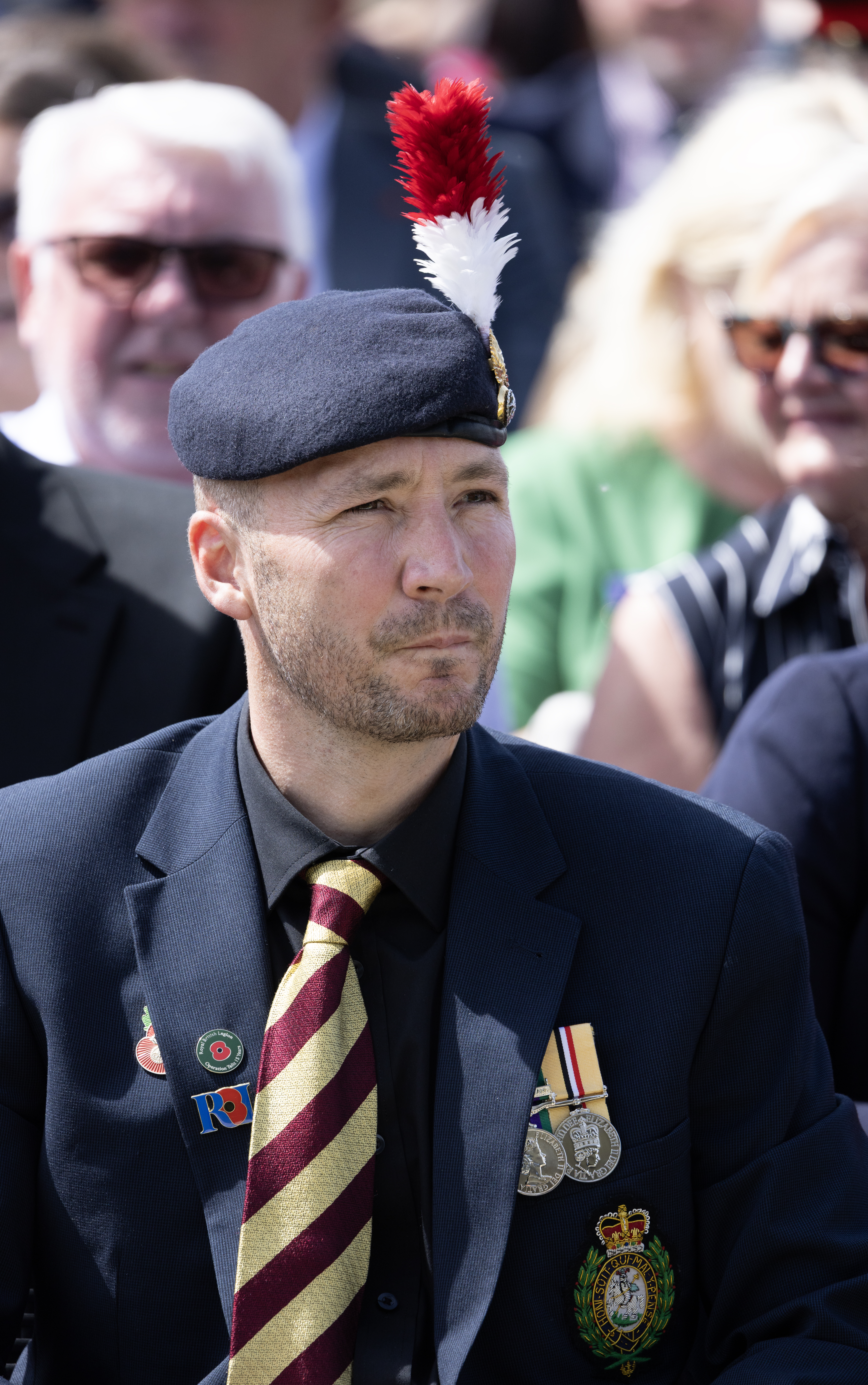 Military member in uniform at a Royal British Legion Armed Forces Day event.